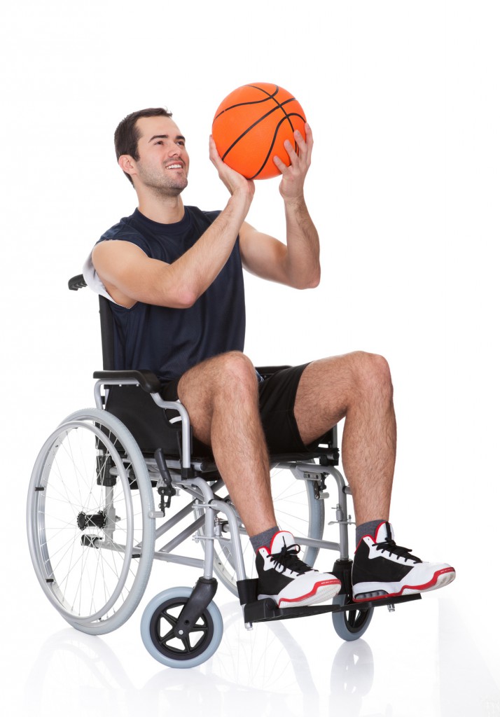 Man in wheelchair playing basketball